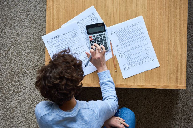 Photo of a Man with a Calculator